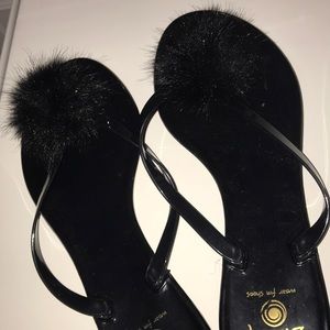 black Pom Pom flip flops